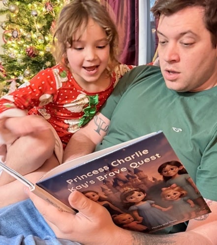 Adult and child sharing a personalized book together.